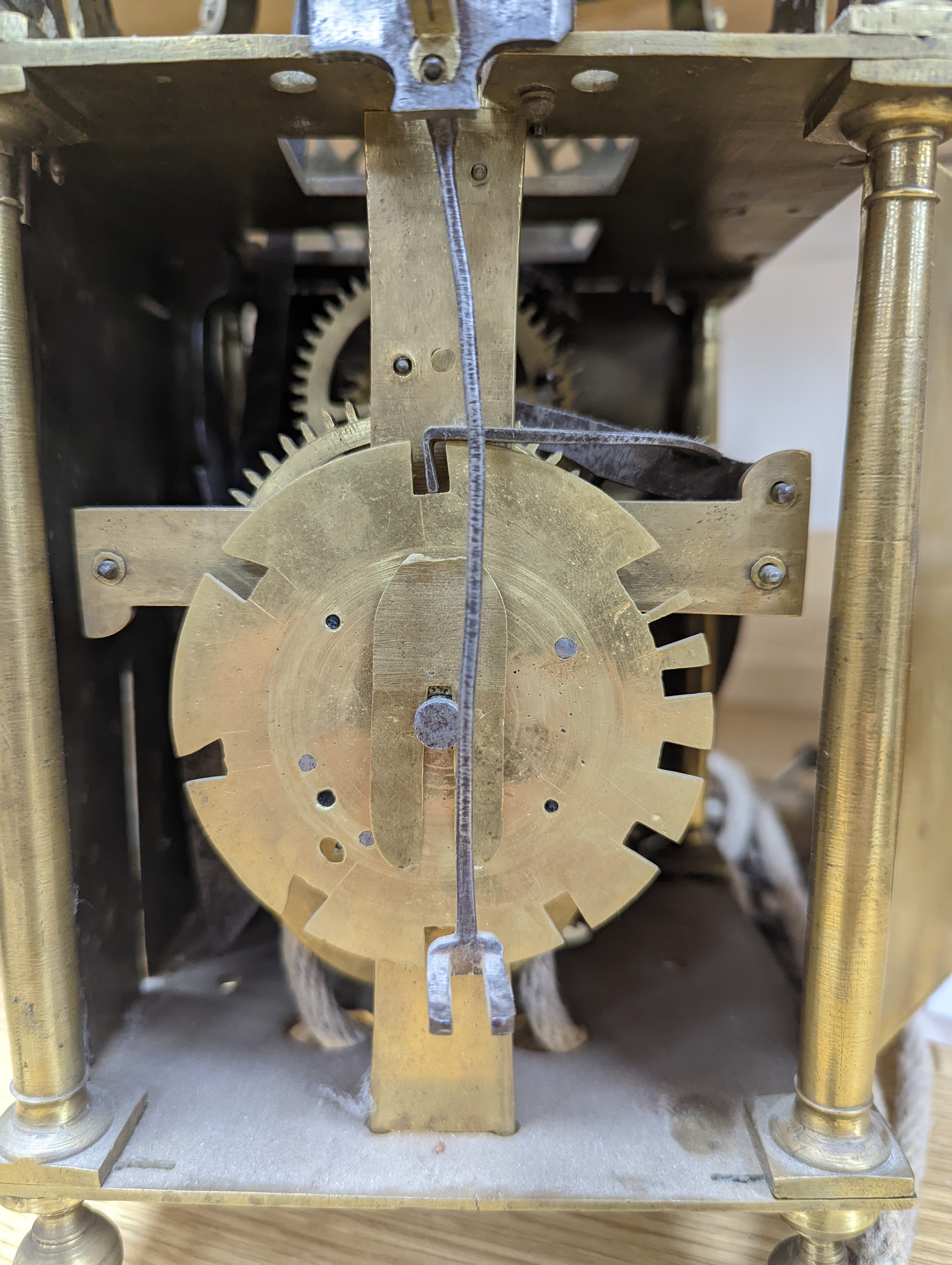 A 17th century style brass lantern clock width 15cm depth 15cm height 40cm